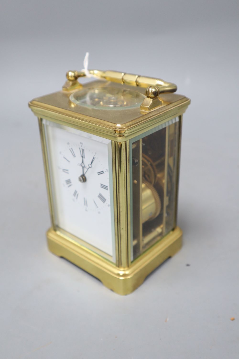 A modern gilt brass enamel dial upright rectangular striking carriage clock, signed Angelus to white Roman dial, overall height 14.5cm